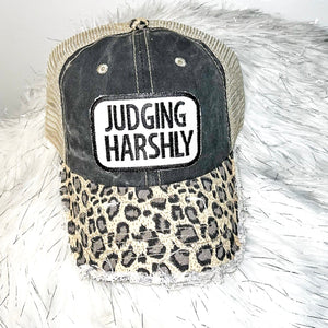 JUDGING HARSHLY Distressed Trucker Hat-Black Leopard