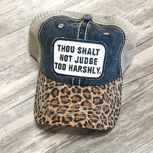 THOU SHALT NOT JUDGE TOO HARSHLY. Distressed Trucker Hat-Black Leopard